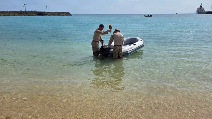 Marines assigned to the III Expeditionary Operations Training Group, III Marine Expeditionary Force, test custom built unmanned surface vessels at Naval Base White Beach, Okinawa, Japan, March 9, 2026. The systems were evaluated by employing onboard communication systems on rubber rafts in varying sea states by analyzing different haul types and designs.