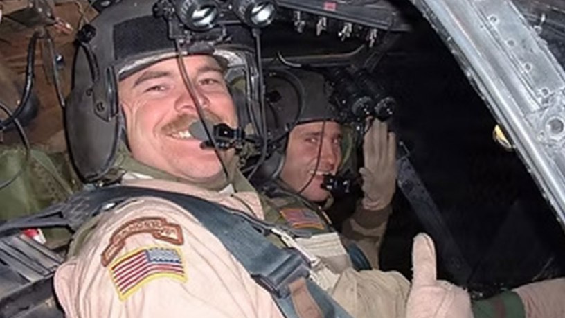 U.S. Army Chief Warrant Officer 4 Brent South offers a thumbs up from seat of a Kiowa Warrior OH-58D in Taji, Iraq, June 12, 2004. South survived a crash that destroyed a helicopter, and nearly took his life. (Courtesy photo)