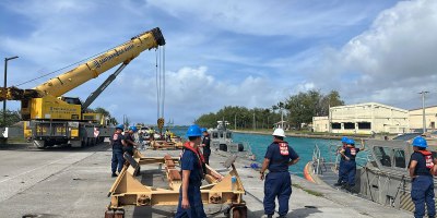 Members of the U.S. Coast Guard Station Apra Harbor prepare to pull 45-foot Response Boat-Mediums to cradle them against storm force winds and prevent damage on April 10, 2026, ahead of storm Sinlaku
