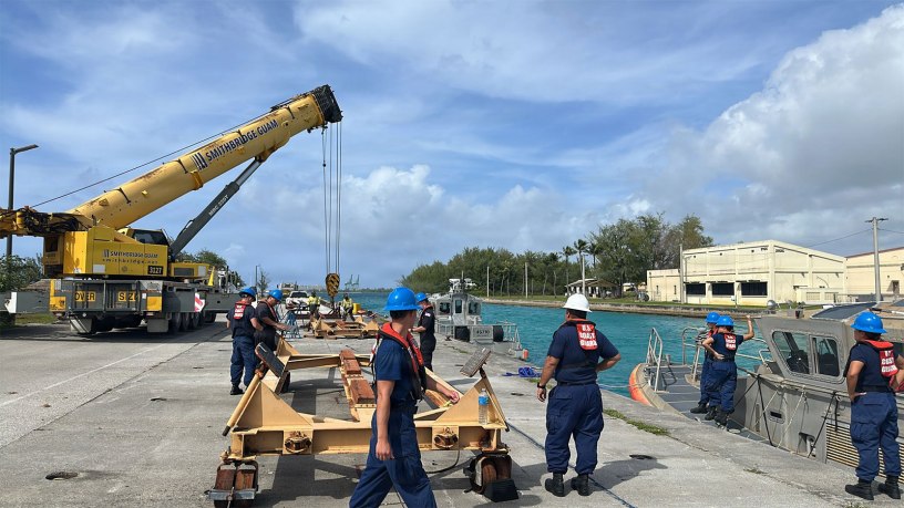 Members of the U.S. Coast Guard Station Apra Harbor prepare to pull 45-foot Response Boat-Mediums to cradle them against storm force winds and prevent damage on April 10, 2026, ahead of storm Sinlaku