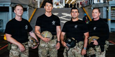 From left, Hospital Corpsman 1st Class Steve Kapala, Lt. Cmdr. Jesse Wang, Chief Hospital Corpsman Vlad Link, and Senior Chief Hospital Corspman Laddy Aldridge, the U.S. Navy dive medical team with Explosive Ordnance Disposal Group 1, pose for a group photo ahead of Artemis II recovery operations while underway on Amphibious transport dock ship USS John P. Murtha (LPD 26) in the Pacific Ocean, April 9, 2026.