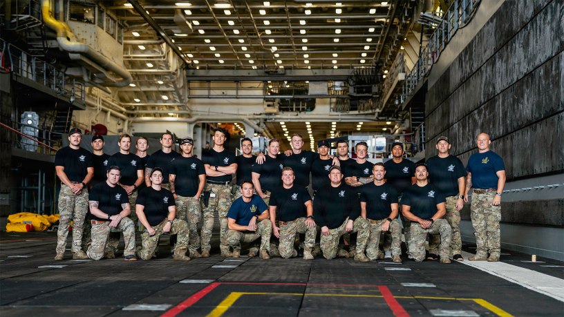 U.S. Navy divers and explosive ordnance disposal technicians pose for a group photo ahead of Artemis II recovery operations while underway on Amphibious transport dock ship USS John P. Murtha (LPD 26) in the Pacific Ocean, April 10, 2026.