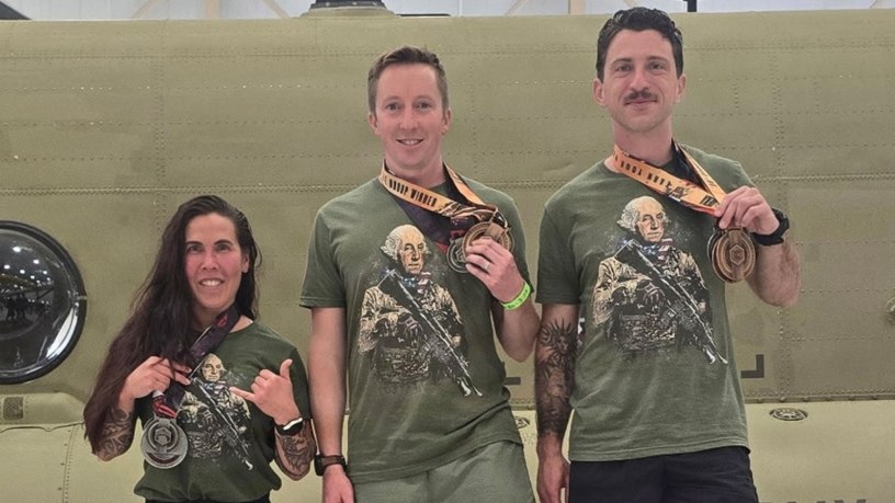 Capt. Julie Keppner, 122nd Theater Public Affairs Support Element; Maj. Brendan Thompson, Special Operations Detachment–Pacific and Capt. Eddy Allen, Headquarters and Headquarters Company, 56th Theater Information Operations Group show off their medals following the National Guard Endurance Team trials, held as part of the Nebraska DekaFit Road Show at the Nebraska Army Aviation Support Center in Grand Island, Nebraska, April 11, 2026. (Courtesy Photo)