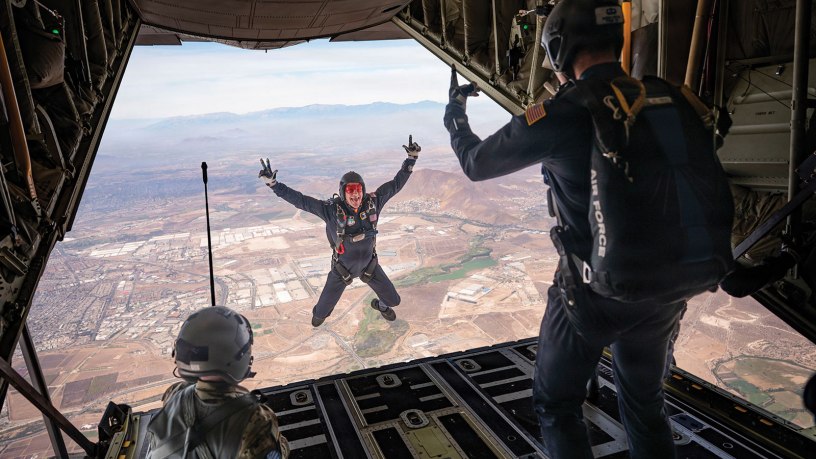 A U.S. Air Force Academy Wings of Blue parachute team member exits a Texas Air National Guard C-130J Super Hercules over Santiago, Chile, during the Feria Internacional del Aire y del Espacio (FIDAE), April 11, 2026. Their participation showcased the skill and training of future Air Force leaders while strengthening connections with partner nations. (U.S. Air Force photo by Airman 1st Class Samantha Melecio)