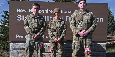 From left, Cadet Quinn LaRock of University of New Hampshire’s Army ROTC program; Master Sgt. Amber Martine, 157th Security Forces Squadron; New Hampshire Air National Guard; and Staff Sgt. Timothy Bowman, a recruiter with New England Recruiting Battalion; assemble after completing a Norwegian Foot March on April 12, 2026, at the state military reservation in Concord, New Hampshire.