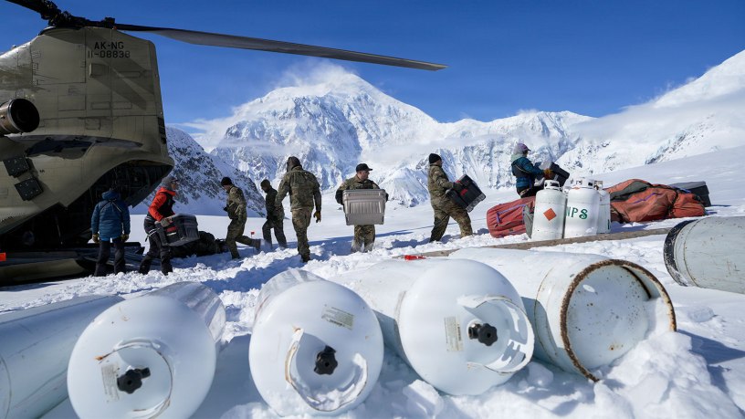 Alaska Army National Guard CH-47F Chinook aircrew members and National Park Service personnel assigned to Denali National Park and Preserve’s Denali Rescue Team offload equipment at Denali Base Camp on the Kahiltna Glacier, April 14, 2026. The crews delivered more than 5,500 pounds of cargo to support the establishment of base camp operations ahead of the climbing season on Mount McKinley. (Alaska National Guard photo by Dana Rosso)
