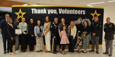 USAG BAVARIA - HOHENFELS, Germany -- Volunteers and Army leadership take a group photo together. Leadership from U.S. Army Garrison Bavaria and the Joint Multinational Readiness Center took time to honor the dedication of volunteers in the Hohenfels community during a ceremony April 14, 2026 at the Community Activity Center. (U.S. Army photo by Bryan Gatchell, USAG Bavaria Public Affairs)