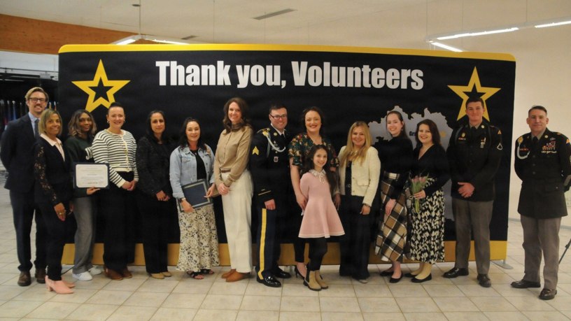 USAG BAVARIA - HOHENFELS, Germany -- Volunteers and Army leadership take a group photo together. Leadership from U.S. Army Garrison Bavaria and the Joint Multinational Readiness Center took time to honor the dedication of volunteers in the Hohenfels community during a ceremony April 14, 2026 at the Community Activity Center. (U.S. Army photo by Bryan Gatchell, USAG Bavaria Public Affairs)