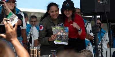 U.S. Air Force Amaryllis Cotto, aerial reconnaissance weather officer with the 53rd Weather Reconnaissance Squadron, is suprised with a local news cover that features a cartoon character of herself in San Juan, Puerto Rico, April 18, 2026. The 403rd Wing's 53rd Weather Reconnaissance Squadron and a team of National Oceanic and Atmospheric Administration forecasters visited Marathon, Florida; Roatan, Honduras; Belize City, Belize; and San Juan, Puerto Rico as part of the annual Caribbean Hurricane Awareness Tour, April 14-18, 2026.