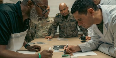 Donnell Seals, left, explains a forensic concept to a Tunisian Armed Forces forensic analyst during exercise African Lion 2026 in Bizerte, Tunisia, April 20, 2026. African Lion 2026 (AL26) is U.S. Africa Command's largest annual joint exercise, designed to strengthen collective security capabilities of the U.S., African nations and global allies. Co-led by U.S. Army Southern European Task Force, Africa (SETAF-AF) from April 20 to May 8, 2026, and hosted in Ghana, Morocco, Senegal, andTunisia, AL26 involves over 5,600 personnel from more than 40 nations, using innovation to drive partner-led regional security. (U.S. Army photo by Capt. Katherine Sibilla)