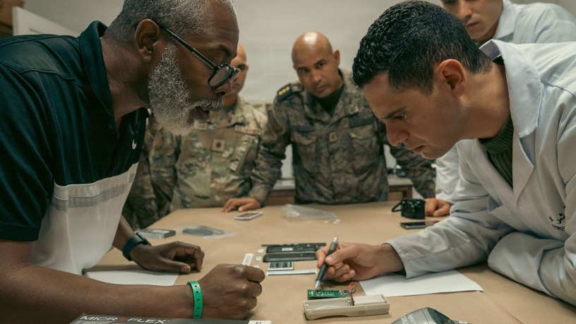 Donnell Seals, left, explains a forensic concept to a Tunisian Armed Forces forensic analyst during exercise African Lion 2026 in Bizerte, Tunisia, April 20, 2026. African Lion 2026 (AL26) is U.S. Africa Command's largest annual joint exercise, designed to strengthen collective security capabilities of the U.S., African nations and global allies. Co-led by U.S. Army Southern European Task Force, Africa (SETAF-AF) from April 20 to May 8, 2026, and hosted in Ghana, Morocco, Senegal, andTunisia, AL26 involves over 5,600 personnel from more than 40 nations, using innovation to drive partner-led regional security. (U.S. Army photo by Capt. Katherine Sibilla)
