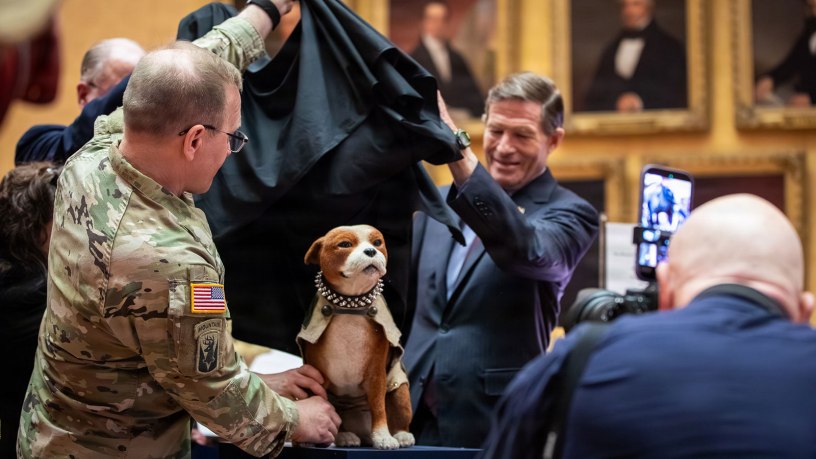 U.S. Sen. Richard Blumenthal and Maj. Gen. Francis J. Evon Jr., the adjutant general of the Connecticut National Guard, unveil a statue of Sgt. Stubby during a ceremony at the Connecticut State Library in Hartford, Connecticut, April 20, 2026. The unveiling marked the 100th anniversary of the death of Stubby, a stray dog adopted by Cpl. J. Robert Conroy in 1917 who went on to serve with the 102nd Infantry Regiment. (U.S. Army National Guard photo by Spc. Emmanuel Gibson)