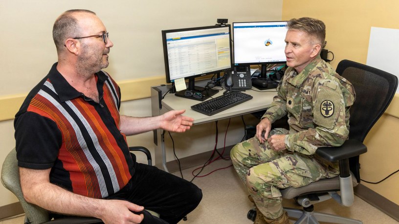 U.S. Army Lt. Col. Matthew Dugard, a primary care physician, uses ambient listening software during a patient appointment on April 20, 2026, at Walter Reed National Military Medical Center, Bethesda, Md. Walter Reed medical professionals participated in a trial to test ambient listening software. As a first-class medical care center, Walter Reed continually explores the latest technology for its providers who care for military members and their families. (DOW photo by Ann Brandstadter)
