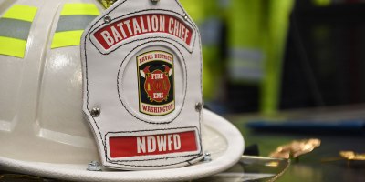A battalion chief helmet sits on the awards table at the Naval Support Facility (NSF) Dahlgren Fire Station during an April 21 recognition and promotion ceremony for members of Naval District Washington (NDW) Fire and Emergency Services Dahlgren Company.