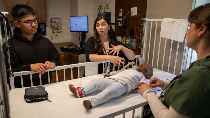 U.S. Army Reserve Spc. Kurt Callas, left, and Spc. Stephanie Berry, right, both practical nursing specialists (68C) assigned to the 303rd Field Hospital, tour the University of Missouri–St. Louis College of Nursing as prospective students for the new Licensed Practical Nurse (LPN) to Bachelor of Science in Nursing (BSN) bridging program, April 22, 2026. The program allows qualified Army LPNs to build on their military training and pursue a BSN through an accelerated, four-semester pathway. (U.S. Army photo by Staff Sgt. Mikayla Fritz)