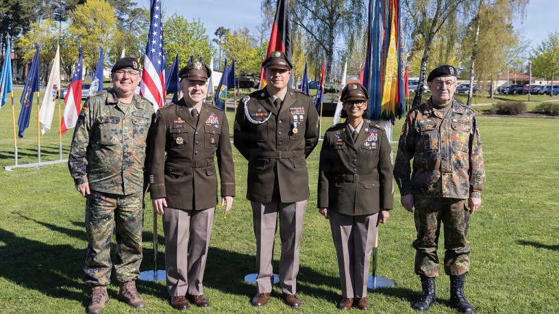 U.S. Army Maj. Gen. Michael Lalor, commanding general of the 21st Theater Sustainment Command, Command Sgt. Maj. Denice Malave, senior enlisted advisor of the 21st TSC, Sgt. Daniel T. Beltran, a bridge crewmember assigned to the 809th Multi-Role Bridge Company, 7th Engineer Brigade, and German military leaders pose for a photo following a Soldier’s Medal ceremony at Tower Barracks, Grafenwoehr, Germany, April 24, 2026.