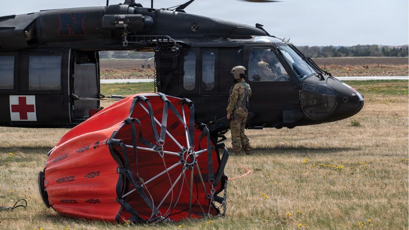 A UH-60 Blackhawk crew from Company G, 2-104th General Aviation Support Battalion, assists in fighting wildfires, April 23 – 25, 2026, near Broken Bow, Nebraska. The soldiers had originally planned on conducting a field training exercise in the area, but diverted assets to assist with real-world domestic operations needs. (U.S. Air National Guard photo by Tech. Sgt. Phil Cowen)
