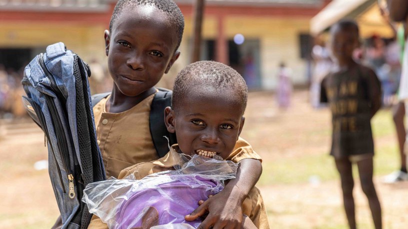 Two young boys holding their new backpacks following a school supplies donation ceremony at the Ouffoué-Diékro Primary School during exercise Flintlock 26 in Ouffoué-Diékro, Côte d’Ivoire, April 24, 2026.