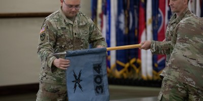 Lt. Col. Jeremy Mason uncases the colors for the newly established 304th Cyber Battalion, Army Reserve Cyber Protection Brigade at Camp Parks, Calif., on April 11, 2026.