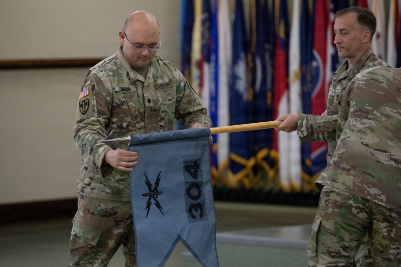 Lt. Col. Jeremy Mason uncases the colors for the newly established 304th Cyber Battalion, Army Reserve Cyber Protection Brigade at Camp Parks, Calif., on April 11, 2026.