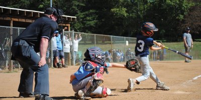 U.S. Army Reserve Staff Sgt. Fred Brown locks his eyes on the strike zone to call a pitch during a youth baseball game in Spotsylvania County, Virginia, May 11, 2024. As a volunteer umpire and league president, Brown extends his dedication to selfless service from the military to the local baseball diamond.