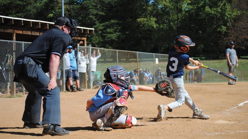 U.S. Army Reserve Staff Sgt. Fred Brown locks his eyes on the strike zone to call a pitch during a youth baseball game in Spotsylvania County, Virginia, May 11, 2024. As a volunteer umpire and league president, Brown extends his dedication to selfless service from the military to the local baseball diamond.