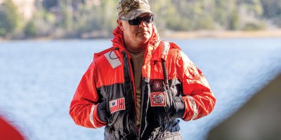 Chief Warrant Officer James Meadows, DDE-Boat Ops advisor at SMTC, observes operational brief to U.S. Coast Guard District 5 Command at Special Missions Training Center, Camp Lejeune, December 12, 2024. (U.S. Coast Guard photo by Petty Officer 2nd Class Crystal Burgess)