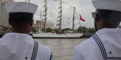 U.S. Sailors watch the BAP Union (BEV-161), a Peruvian sail training ship, aboard steamboat Natchez, one of the last authentic steam powered paddle boats in New Orleans, celebrate Sail 250, May 28, 2026.