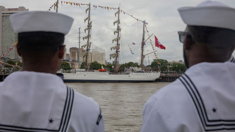 U.S. Sailors watch the BAP Union (BEV-161), a Peruvian sail training ship, aboard steamboat Natchez, one of the last authentic steam powered paddle boats in New Orleans, celebrate Sail 250, May 28, 2026.