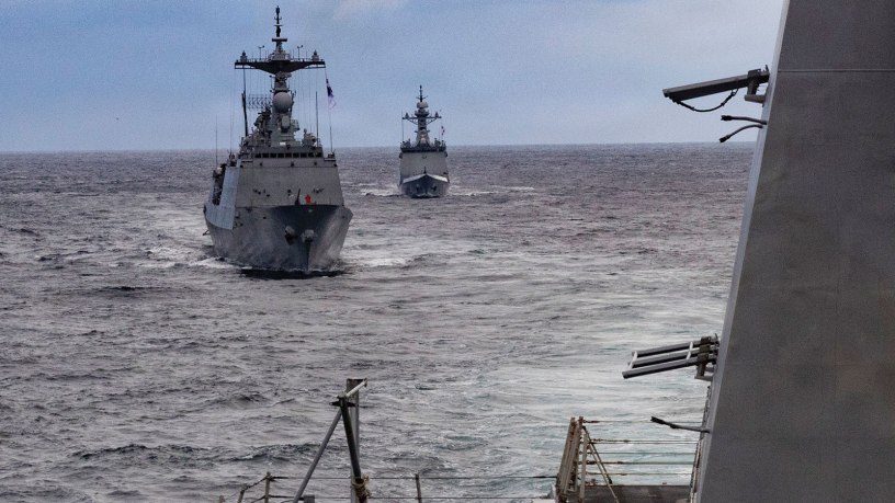 The Republic of Korea (ROK) Navy Chungmugong Yi Sun-sin-class destroyer ROKS Wang Geon (DDG 978), left, and Daegu-class frigate ROKS Daejeon (FFG 823), right, sail in formation aft of Arleigh Burke-class guided-missile destroyer USS Dewey (DDG 105) during the Maritime Counter Special Operations Exercise (MCSOFEX) with the ROK Navy, Nov. 18, 2025.