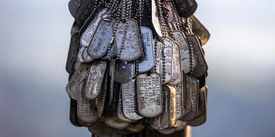 Dog tags hang atop Memorial Hill, commonly known as “The Beast,” at Marine Corps Base Camp Pendleton, California, Dec. 18, 2025. The hill marks the end of a physically demanding trail that units climb in honor of fallen Marines. (U.S. Marine Corps photo by Sgt. Sean Potter)