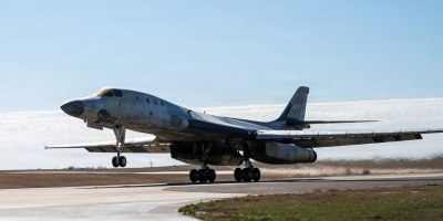 A U.S. Air Force B-1B Lancer performs a functional check flight in a stripped, bare-metal configuration over Tinker Air Force Base, Oklahoma, Feb. 26, 2026. The aircraft was undergoing depot maintenance after being removed from long-term storage and is part of an effort to return the bomber to service. (U.S. Air Force photo by Courtney Landsberger)