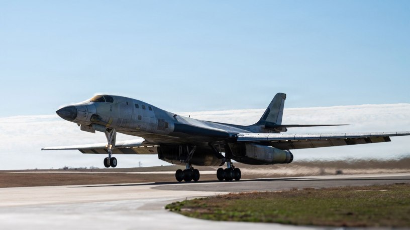 A U.S. Air Force B-1B Lancer performs a functional check flight in a stripped, bare-metal configuration over Tinker Air Force Base, Oklahoma, Feb. 26, 2026. The aircraft was undergoing depot maintenance after being removed from long-term storage and is part of an effort to return the bomber to service. (U.S. Air Force photo by Courtney Landsberger)