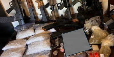 Illicit drugs and weapons sit on display after seizure by the Georgia Bureau of Investigation and the Butts County Sheriff’s Office in March. The Georgia National Guard Counterdrug Task Force, which supports state, local, and federal law enforcement agencies in the detection, interdiction and disruption of drug trafficking and transnational criminal organizations, played a crucial behind the scenes role in the investigation. Portions of this photo have been altered for security purposes. (Courtesy photo)