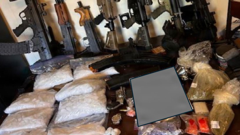 Illicit drugs and weapons sit on display after seizure by the Georgia Bureau of Investigation and the Butts County Sheriff’s Office in March. The Georgia National Guard Counterdrug Task Force, which supports state, local, and federal law enforcement agencies in the detection, interdiction and disruption of drug trafficking and transnational criminal organizations, played a crucial behind the scenes role in the investigation. Portions of this photo have been altered for security purposes. (Courtesy photo)