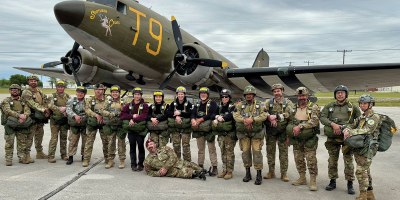 Jon Harmon (front) and members of the Liberty Jump Team pose in front of the C-49J Southern Cross in Corsicana, Texas, in April 2026. The team completed a basic and airborne refresher course to prepare for commemorative parachute jumps into Normandy, France, marking the 82nd anniversary of D-Day. (Contributed photo)