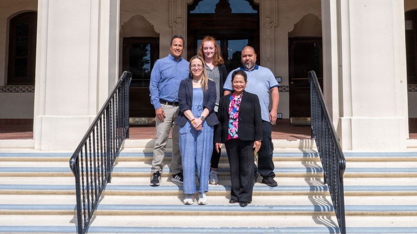 Members of the Digital Strategies and Technology team at the Naval Postgraduate School's Dudley Knox Library pose for a photo in front of Herrmann Hall at NPS in Monterey, Calif. The library team was awarded the inaugural Project of the Year Award from the Library of Congress FEDLINK program for the modernization of the school's digital archives. (U.S. Navy photo by Mass Communication Specialist Seaman Zadi Watkins)