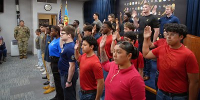 Military applicants who processed through Chicago MEPS take the Oath of Enlistment during a ceremony at U.S. Military Entrance Processing Command headquarters in North Chicago, Illinois, April 15, 2026. USMEPCOM is responsible for processing applicants into the Armed Forces, ensuring each meets enlistment standards.