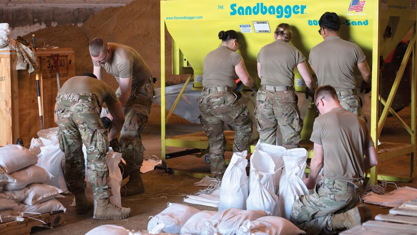 Wisconsin National Guard Soldiers assigned to the 32nd Infantry Brigade Combat Team prepare and palletize sandbags at the Columbia County Highway Department facility in Wyocena, Wisconsin, April 16, 2026. The operation was part of a 13-day state activation during which 83 service members assigned to Task Force-Sandman contributed to flood mitigation efforts in Southern Wisconsin resulting from a series of record setting April storms. (U.S. National Guard photo by Paul Gorman)