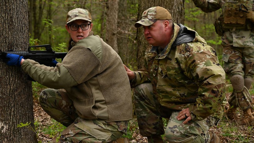 U.S. Air Force Tech. Sgt. Stephanie Wilburn, a religious affairs specialist, and Maj. Bill Newman, a chaplain, both assigned to the 178th Wing, rehearse movement under fire duiring a joint training exercise focused on large-scale combat operations April 25, 2026 at Camp Garfield in Ravenna, Ohio. The training included more than 45 chaplains from the Ohio National Guard, Ohio Militia, and Serbian Defense Forces. (U.S. Air National Guard photo by Shane Hughes)