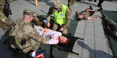 Firefighters assigned to U.S. Army Garrison Italy take part in a mock earthquake emergency response exercise at the Golden Lion Conference Center on Caserma Ederle, April 29, 2026. The exercise tested and validated Italian and American joint force protection and emergency management procedures in response to a simulated earthquake emergency. (U.S. Army photo by Graigg Faggionato)