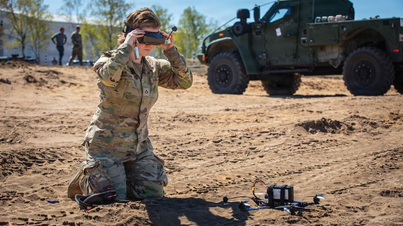 Pfc. Hailey Paton, an infantryman assigned to Echo Troop, 2nd Squadron, 2nd Cavalry Regiment, dons first-person view goggles before operating a small unmanned aerial system during Project FlyTrap 5.0 at Pabradė Training Area, Lithuania, May 2, 2026. FlyTrap directly supports the Eastern Flank Deterrence Initiative by evaluating scalable counter-drone solutions that can integrate into NATO's existing air defense networks. (U.S. Army photo by Sgt. Max Elliott)