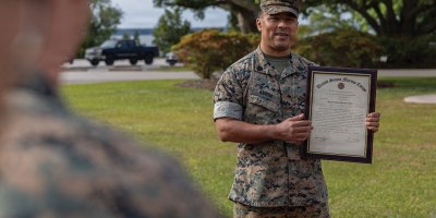 U.S. Marine Corps Gunnery Sgt. Alejandro Abrego, an assistant supply chief with 2nd Marine Expeditionary Brigade speaks during a promotion ceremony at Camp Lejeune, North Carolina, May 1, 2026. The ceremony highlights Abrego and publicly recognizes him as proven worthy of wearing the rank of Gunnery Sergeant. (U.S. Marine Corps photo by Lance Cpl. Ethan Claassen)