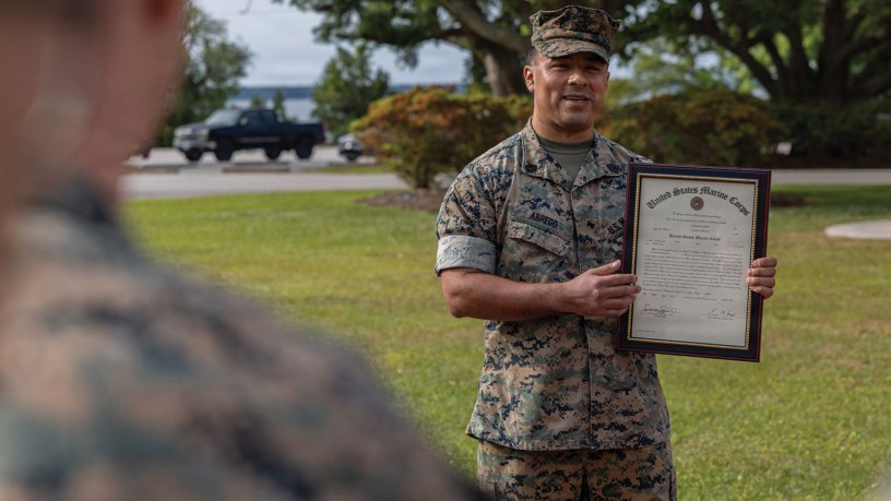 U.S. Marine Corps Gunnery Sgt. Alejandro Abrego, an assistant supply chief with 2nd Marine Expeditionary Brigade speaks during a promotion ceremony at Camp Lejeune, North Carolina, May 1, 2026. The ceremony highlights Abrego and publicly recognizes him as proven worthy of wearing the rank of Gunnery Sergeant. (U.S. Marine Corps photo by Lance Cpl. Ethan Claassen)