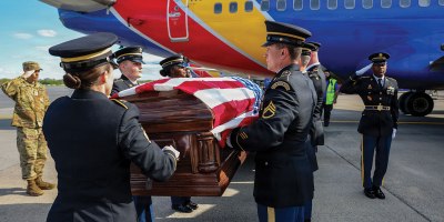 Soldiers assigned to the New York Army National Guard Honor Guard prepare to carry the coffin containing the remains of Army Air Corps 2nd Lt. Joseph L. Burke from a Southwest airliner to a waiting hearse at Albany International Airport in Latham on May 1, 2026, during a dignified transfer of remains. Burke was taken prisoner by the Japanese in the Philippines in 1941 and killed by U.S. aircraft inadvertently in 1945. His remains were identified in 2025 and returned to his family in Troy, New York. (U.S. Air National Guard photo by Master Sgt. Jamie Spaulding)