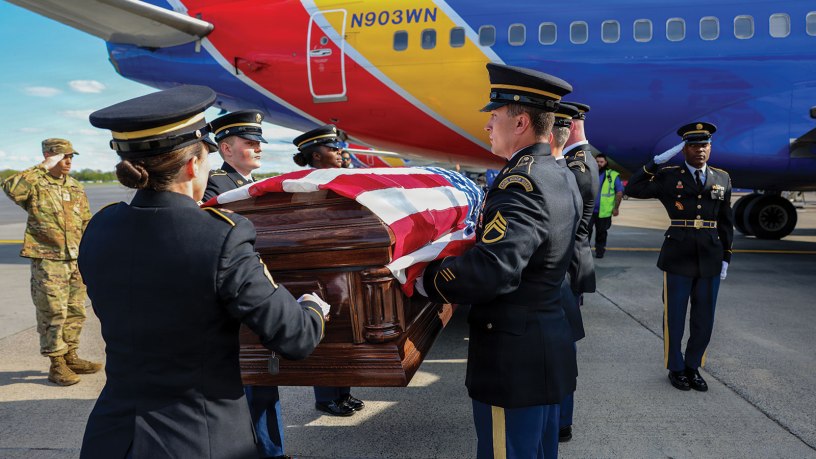 Soldiers assigned to the New York Army National Guard Honor Guard prepare to carry the coffin containing the remains of Army Air Corps 2nd Lt. Joseph L. Burke from a Southwest airliner to a waiting hearse at Albany International Airport in Latham on May 1, 2026, during a dignified transfer of remains. Burke was taken prisoner by the Japanese in the Philippines in 1941 and killed by U.S. aircraft inadvertently in 1945. His remains were identified in 2025 and returned to his family in Troy, New York. (U.S. Air National Guard photo by Master Sgt. Jamie Spaulding)