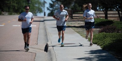 U.S. Air Force Capt. Jason Engel, Staff Sgt. William Lipscomb, and Tech. Sgt. Alyson McCormack run during the 2026 Port Dawg Memorial Run at Peterson Space Force Base, Colo., May 2, 2026. The annual event honored fallen Airmen from the aerial port community by bringing together service members for a memorial run. (U.S. Air Force photo by Senior Airman John Lewis IV)
