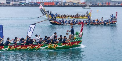 The Army Black Knights race in the yellow dragon boat during their heat at the Naha Haarii dragon boat races at Naha Port, Okinawa, Japan, May 5, 2026.