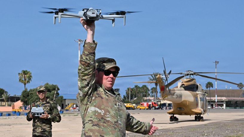 U.S. Army Sgt. 1st Class Brent Ottinger, an instructor assigned to 7th Army Training Command Combined Arms Training Center, demonstrates a landing technique during proficiency demonstration training on an unmanned aerial system with members of the Royal Moroccan Air Force during the inaugural African Lion 26 drone academics at Southern Zone Headquarters, Agadir, Morocco, May 4, 2026.