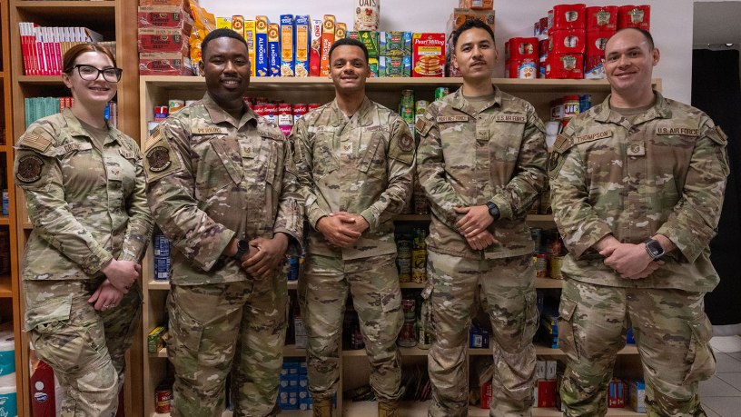 U.S. Air Force Airmen assigned to the 31st Fighter Wing pose for a group photo during the Food Pantry opening on Aviano Air Base, Italy, May 4, 2026. These volunteers helped to set up, organize and obtain supplies for the food pantry. (U.S. Air Force photo by TaeLani Allen-Lewis)